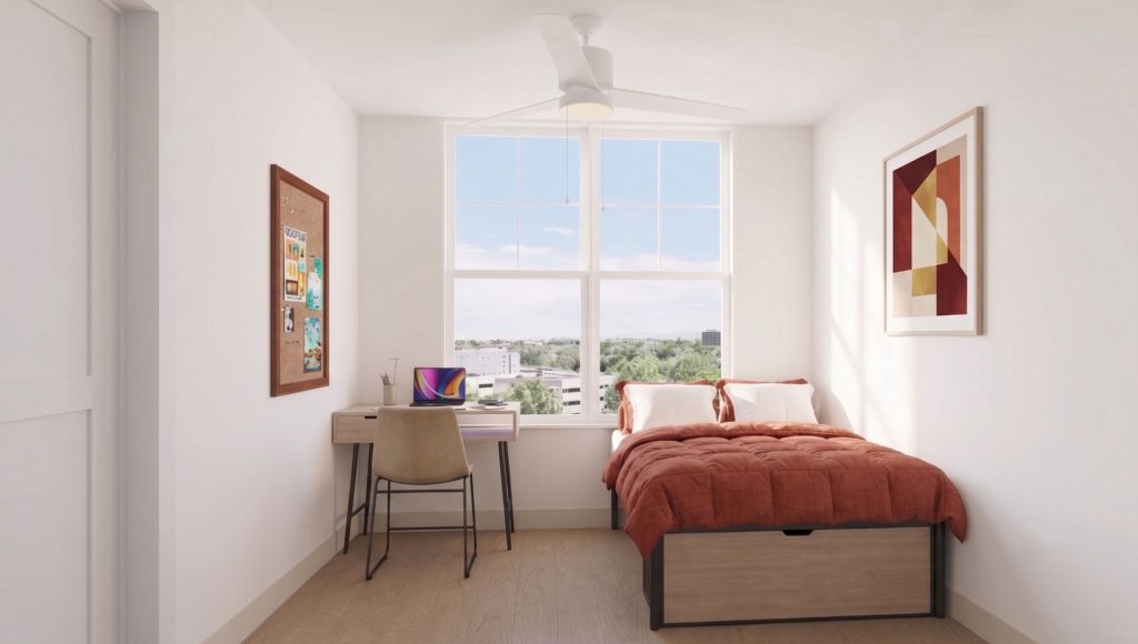 Furnished bedroom rendering in a modern Brickside apartment, featuring a bed, desk, chair, and window with natural light.
